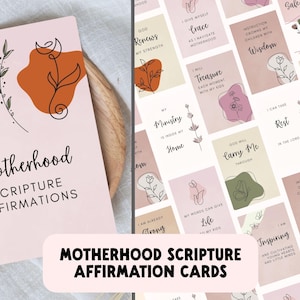 May include: A set of Motherhood Scripture Affirmation cards. The cards are light pink with abstract shapes and floral line art. The text on the cards includes affirmations like "Grace," "Wisdom," and "Life."