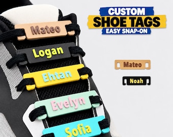 May include: Five rectangular custom shoe tags attached to black shoelaces on a sneaker. The tags are brown, black, yellow, light green, and light blue with names Mateo, Logan, Ehtan, Evelyn, and Sofia. Text reads CUSTOM SHOE TAGS EASY SNAP-ON.