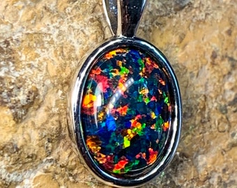 Heart's Art Australia- Play of Colour - Sterling Silver 10x8mm Solid Red Green Black created Opal bezel set pendant- Great Gift for women!