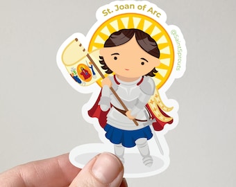 May include: A sticker featuring a cartoon illustration of St. Joan of Arc. She is depicted in silver armor, a red cape, and a blue skirt, holding a banner. The sticker has the text "St. Joan of Arc" and the @SaintSprouts logo.