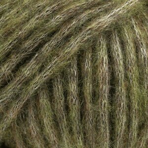 May include: Close-up of a skein of green and white yarn. The yarn is soft and fluffy, with a subtle sheen.