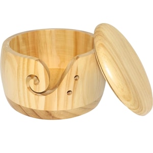 May include: A wooden yarn bowl with a lid and a built-in yarn guide. The bowl is light brown and has a natural wood grain.
