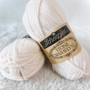May include: Two balls of off-white yarn labelled "Scheepjes Stone Washed XL"