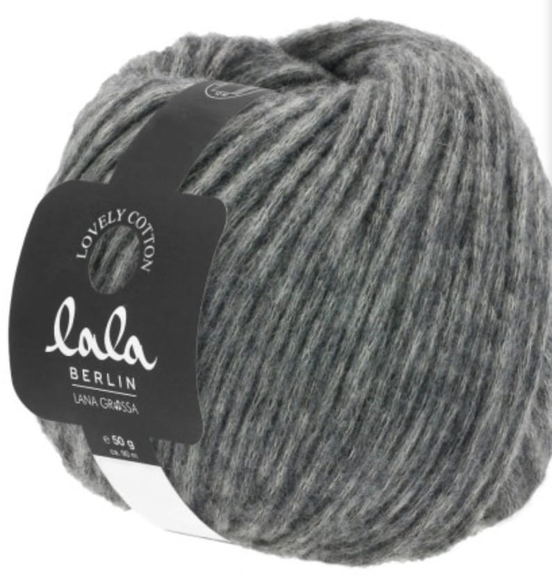 May include: A ball of gray yarn with a label that reads "lola BERLIN LANA GRASSA e 50 g"