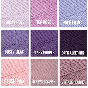 May include: Nine skeins of yarn in various shades of purple and pink. The colors include Dusty Rose, Tea Rose, Pale Lilac, Dusty Lilac, Pansy Purple, Dark Aubergine, Blush Pink, Candyfloss Pink, and Vintage Heather.