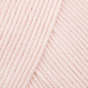 May include: Close-up of a soft, pale pink yarn. The yarn is made of cotton and is perfect for knitting or crocheting.