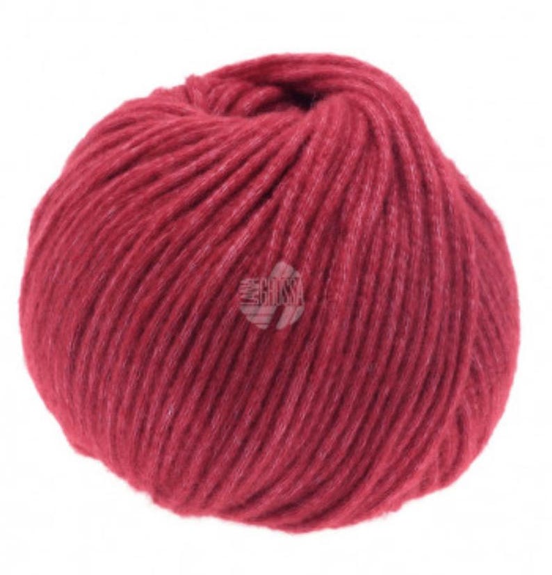 May include: A ball of deep red yarn, perfect for knitting or crocheting projects.