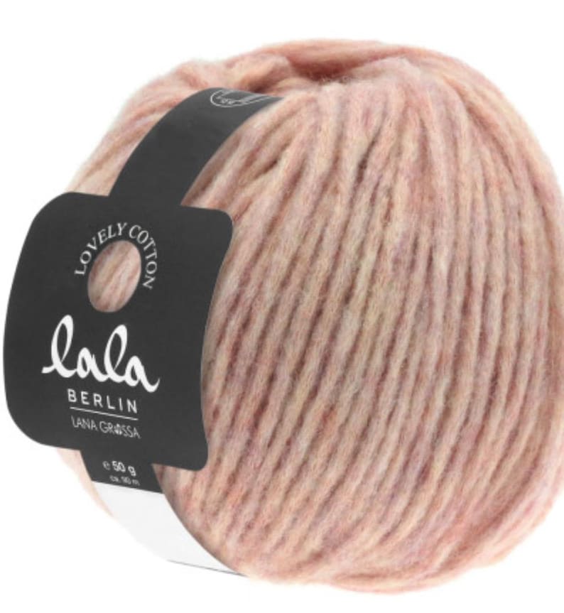 May include: A ball of pink and beige yarn with a label that reads "lala BERLIN LANA GROSSA e 50 g"
