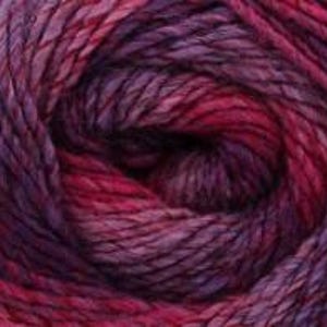 May include: Close-up of a ball of yarn in shades of purple, magenta, and red. The yarn appears to be a blend of colors, creating a textured and visually appealing effect. The fibers are tightly wound, suggesting a durable and high-quality material suitable for knitting or crocheting projects.