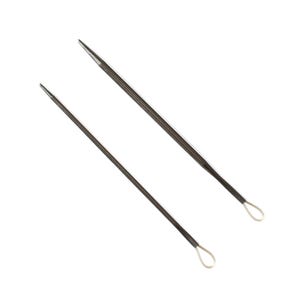 May include: Two metal yarn needles with pointed tips and small loops at the ends. The needles are dark grey and angled against a white background. These needles are used for weaving in yarn ends in knitting or crochet projects.