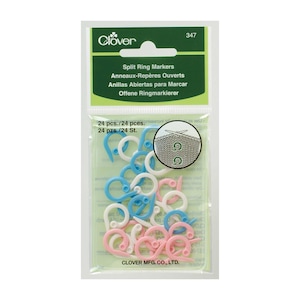 May include: A pack of 24 split ring markers in blue, pink and white. The pack is labelled "Clover Split Ring Markers" and includes the text "24 pcs./24 pces. 24 pzs./24 St. Clover Mfg. Co., Ltd. 347".