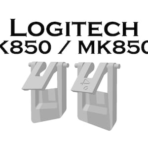 Op de afbeelding: Twee grijze plastic clips voor een Logitech K850 of MK850 toetsenbord.