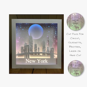 Scatola di ombre in carta tagliata Scatola luminosa 3D SVG PNG Silhouette di New York City Silhouette Cricut File di taglio a mano con laser a strati