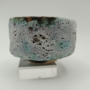 Unique hand made white ceramics cup/vessel. Lava glaze.