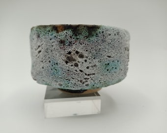 Unique hand made white ceramics cup/vessel. Lava glaze.