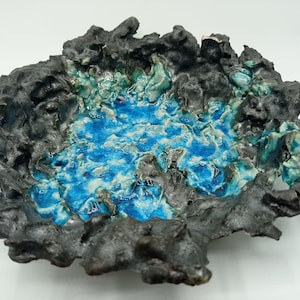 Handmade black ceramic bowl with blue melted glass - decorative sculpture - art object