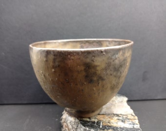 Handmade brown golden ceramic vessel. For decoration only.