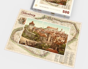 Könnte beinhalten: Ein 500-teiliges Puzzle mit einem Vintage-Postkartenbild von Nürnberg, Deutschland. Die Puzzlebox zeigt einen Panoramablick auf die Stadt mit dem Text "Nürnberg - Nuremberg" und "Panorama vom  Malerthor".