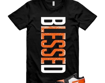 1 camiseta alternativa de tablero bajo roto con estrellas de mar negras, naranja y blanca que combina con VERTBLS