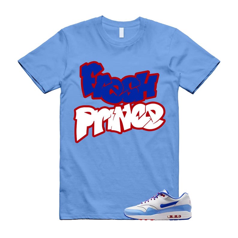 May include: Light blue t-shirt with the words "Fresh Prince" in a graffiti-style design. The text is in blue and white with a red outline. A white, blue, and red sneaker is at the bottom.