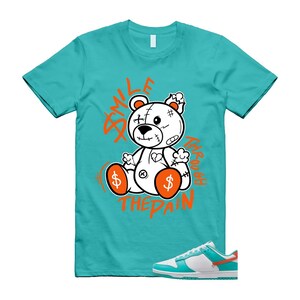 May include: A trio of ceramic mugs with a speckled, matte finish in cream, light grey, and dark grey. The mugs have a simple, minimalist design, suitable for coffee or tea.