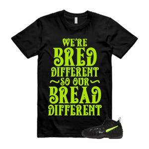 May include: Black t-shirt with the text "WE'RE BRED DIFFERENT SO OUR BREAD DIFFERENT" in neon green. A black and neon green sneaker is visible in the lower right corner.