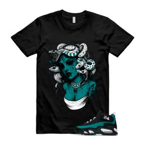May include: A black short-sleeve t-shirt featuring a graphic of a teal-toned figure with snakes for hair and dark eyes, paired with a black and teal high-top sneaker with the number 24 on the strap and a white midsole accent.
