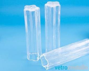 May include: Three clear glass cylinders with a textured surface. The cylinders are approximately 10 inches tall and have a star-shaped opening at the top.