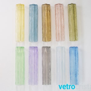May include: Assortment of 12 glass rods in various colors, including yellow, blue, green, purple, gray, white, and light blue. The rods are all the same size and shape, and they have a textured surface.