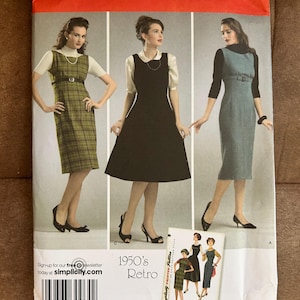 May include: Simplicity sewing pattern 3673 featuring three 1950s retro dress designs. The pattern includes sizes R5 14, 16, 18, 20, and 22. The cover shows illustrations of the dresses in various styles and colors.