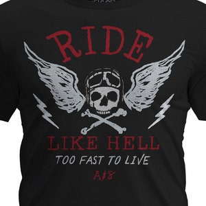 May include: Black t-shirt with a white graphic of a skull wearing a helmet and wings with the text "RIDE LIKE HELL TOO FAST TO LIVE A18".