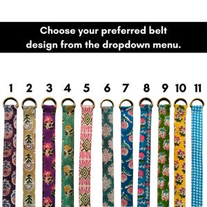 May include: A selection of eleven fabric belts with brass-colored metal rings. Each belt features a unique floral or geometric pattern in various colors, including purple, green, pink, and blue. The text reads: "Choose your preferred belt design from the dropdown menu."