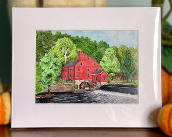 May include: A watercolor painting of a red gristmill with a water wheel, surrounded by green trees and a river. The mill is set against a blue sky with white clouds.