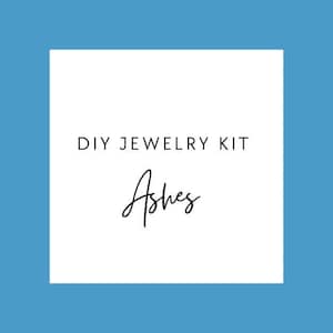 May include: A white square on a blue background displays the text "DIY JEWELRY KIT" in a sans-serif font. Beneath, the word "Ashes" is written in a cursive script. The design is minimalist and contemporary.