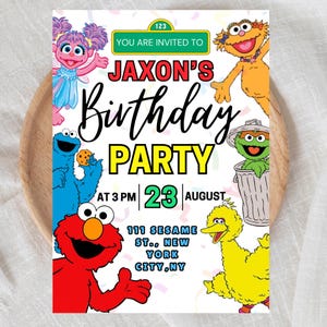 May include: A colorful birthday party invitation featuring Sesame Street characters. The invitation includes the text "Jaxon's Birthday Party" with the date, time, and location: 111 Sesame St., New York City, NY.