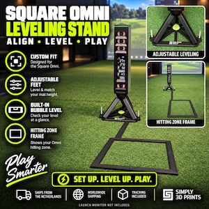 May include: A black Square Omni leveling stand for golf launch monitors, featuring adjustable feet, a built-in bubble level, and a square hitting zone frame. The stand is designed for alignment and leveling on a golf mat, with text labels.