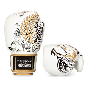 2 Muay Thai gloves in leather with dragon design. Positioned side byside showing the dragon to back and front aspect of gloves.