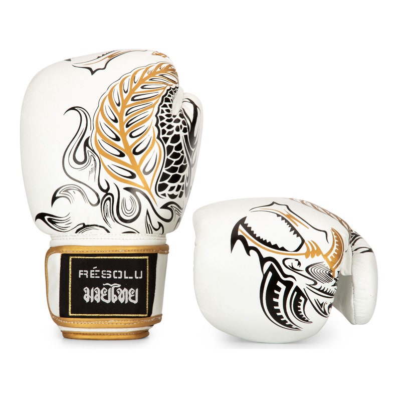 2 Muay Thai gloves in leather with dragon design. Positioned side byside showing the dragon to back and front aspect of gloves.