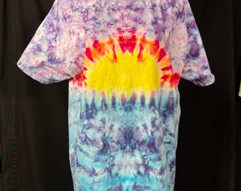 Large t-shirt in a sunset over water design.