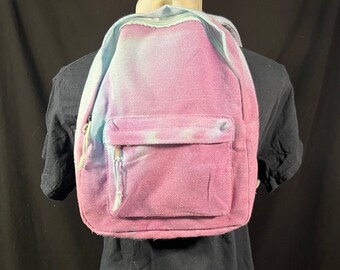 Child size backpack in purple and blue