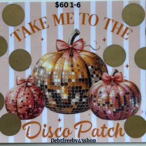 May include: A pink and gold scratch-off game card with the text "Take Me To The Disco Patch" and a design of three disco ball pumpkins. The card has a striped background and gold circles.