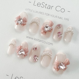 再利用可能なピンクのリボン｜ハンドメイドのジェルネイル（押し付けタイプ）｜期間限定の4つで3つの価格