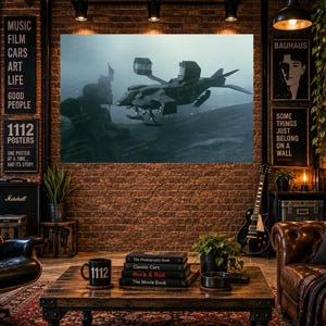 May include: A wall art print featuring a dark, futuristic dropship hovering over a misty, desolate landscape. The aircraft has a distinct angular design with open cargo bays and landing skids, set against a moody, overcast sky in shades of gray.