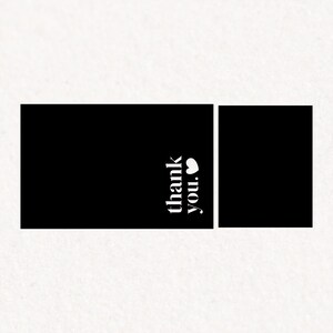 May include: Black and white thank you card with a heart symbol. The card is blank and ready for a message.