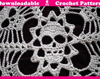 May include: White crochet skull pattern with the text "Downloadable Crochet Pattern" at the top.