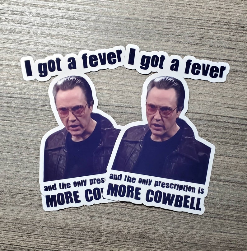 May include: Two stickers featuring a photo of Nicolas Cage with the text "I got a fever I got a fever and the only prescription is MORE COWBELL".
