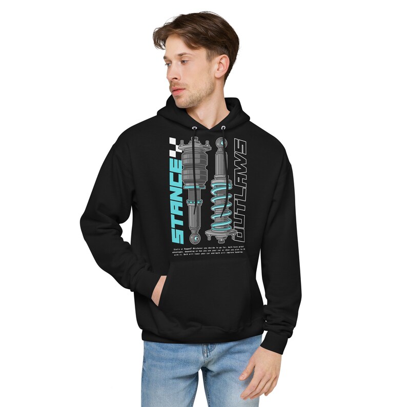 May include: Black hooded sweatshirt with a graphic print of two car suspension parts. The text "STANCE" and "OUTLAWS" is printed vertically on either side of the graphic.