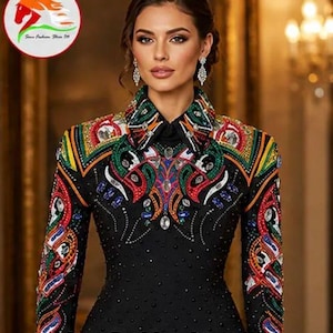 May include: A black long-sleeved shirt featuring a high collar and intricate, colorful embroidery in red, green, yellow, and blue patterns across the shoulders and chest, accented with numerous small black beads and clear crystals.