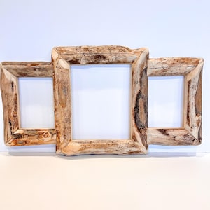 May include: A rustic wooden picture frame with three openings, each with a different size. The frame is made of natural wood with a light brown colour and a rough texture.