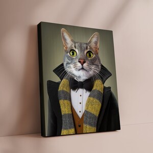 May include: A canvas print featuring a gray tabby cat dressed in formal attire. The cat wears a black tuxedo coat, a bow tie, and a striped scarf in yellow and gray. The cat has bright green eyes and a serious expression.